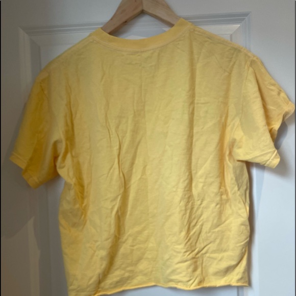 This is a yellow simple T-shirt. It is one-size but I would say it is M-L. - Picture 2 of 2